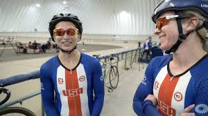 Stephanie and her pilot next to tandem bikes in the Olympic Training Center Velodrome.